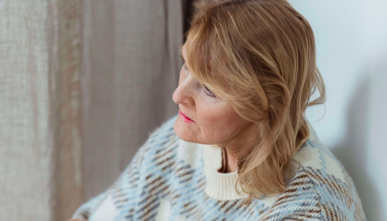 sad older woman looking into the distance and looking sad